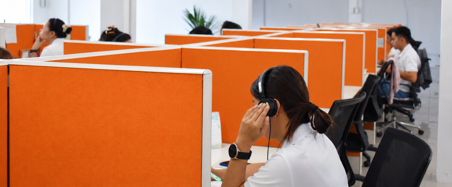 A Bishnoi Omniverse team member working through documents at an office workstation